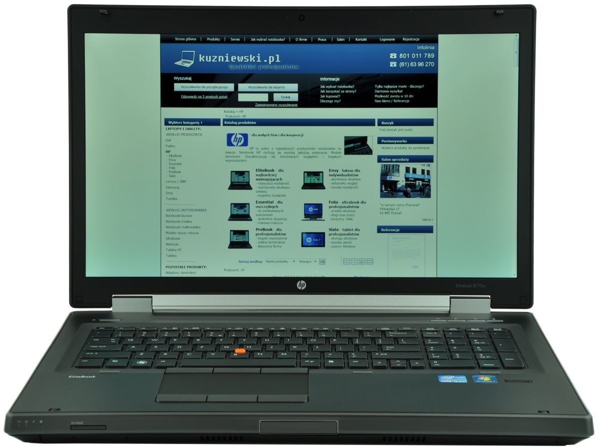 HP EliteBook laptop open to a Polish website homepage with blue header and navigation bars on screen