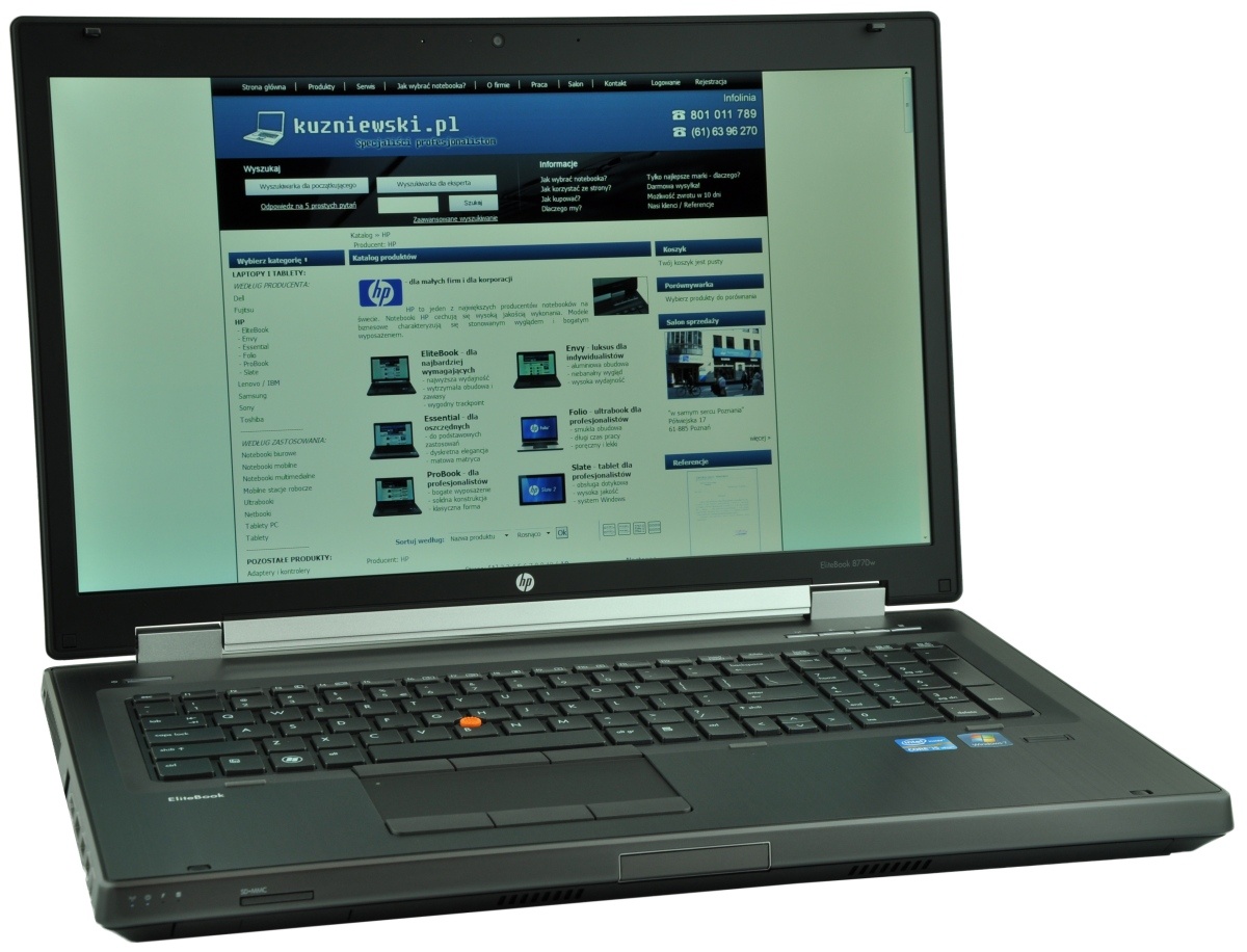 Open HP laptop displaying the kuzniewski.pl homepage in Polish on its screen, with a blue header and product listings.