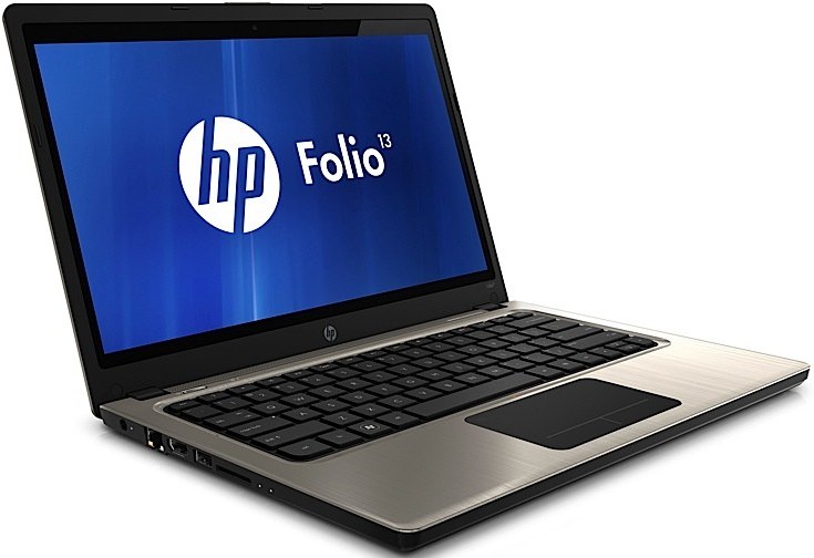 CREATOR gd-jpeg v10 using IJG JPEG v62 quality = 90 - lab-kuzniewski.pl - Testy laptopów, recenzje i porównania Open HP Folio 13 laptop shown at an angle with brushed-metal body and black keyboard; screen displays HP Folio logo.