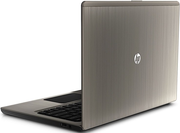 CREATOR gd-jpeg v10 using IJG JPEG v62 quality = 90 - lab-kuzniewski.pl - Testy laptopów, recenzje i porównania Slightly open HP laptop with a brushed metal silver lid, showing the keyboard and touchpad from a rear-right angle.