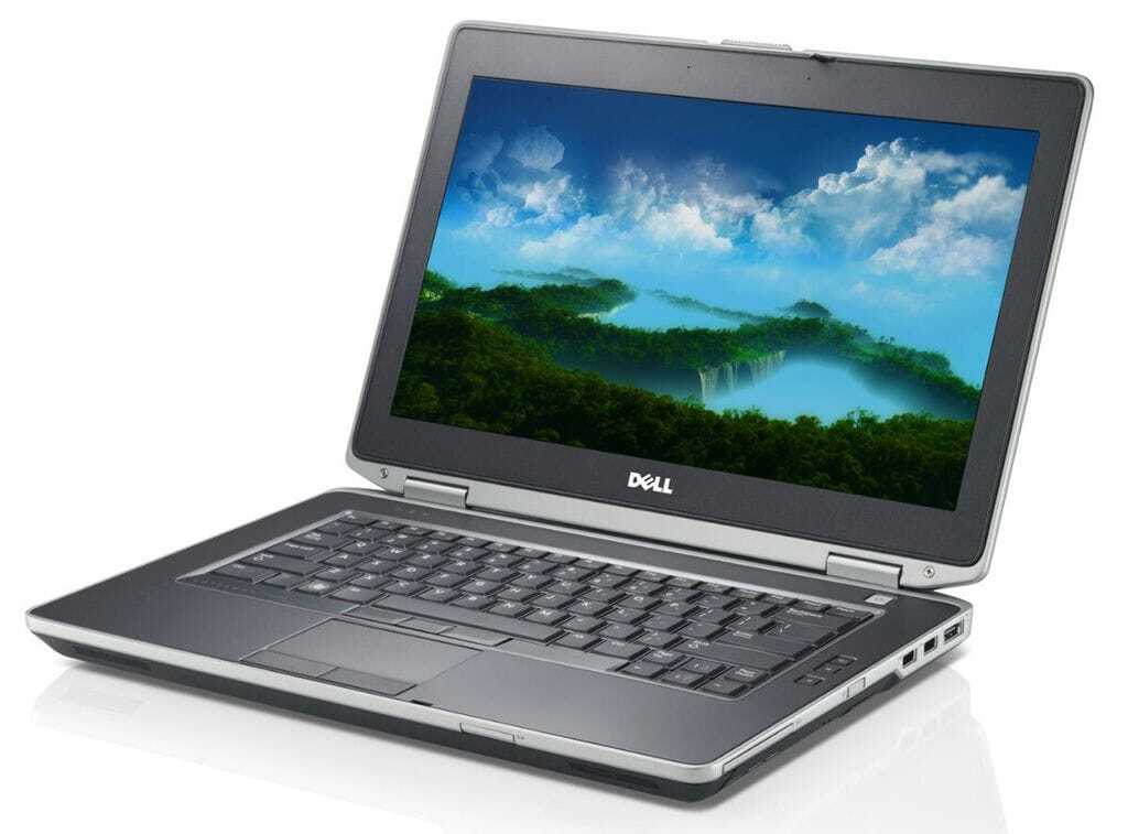 Open Dell laptop displaying a scenic nature wallpaper with blue sky and green hills on a white background.
