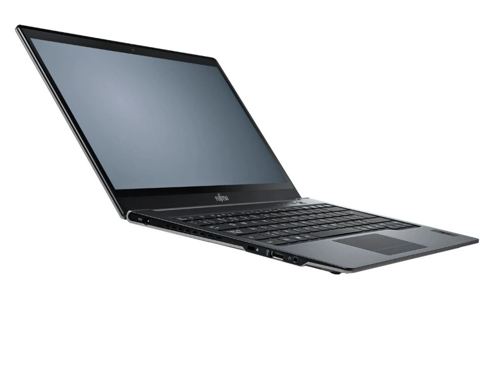 Fujitsu LifeBook U772_0306_05 - lab-kuzniewski.pl - Testy laptopów, recenzje i porównania Open black laptop angled to the left, screen off, keyboard and touchpad visible on a white background.