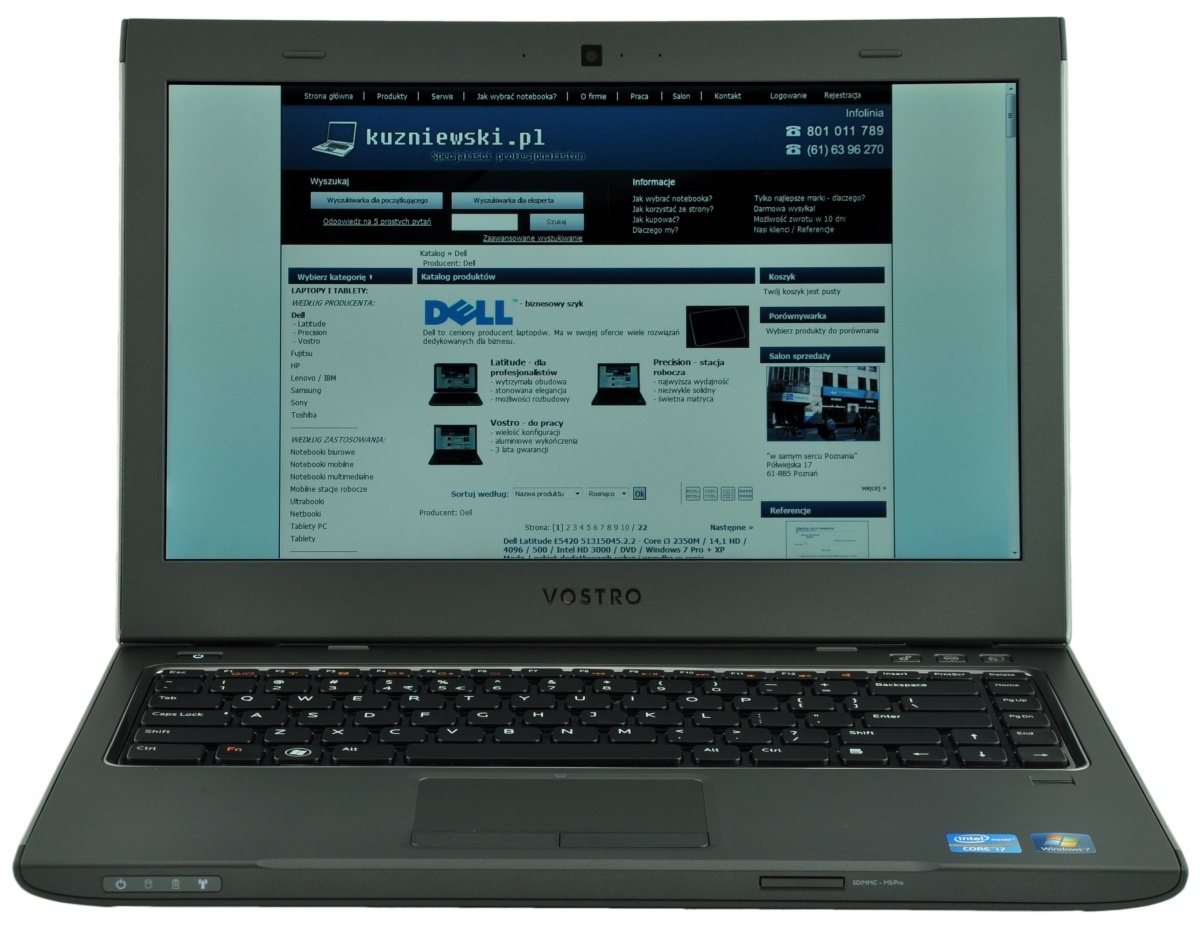 Open Dell Vostro laptop displaying the kuzniewski.pl homepage on screen.