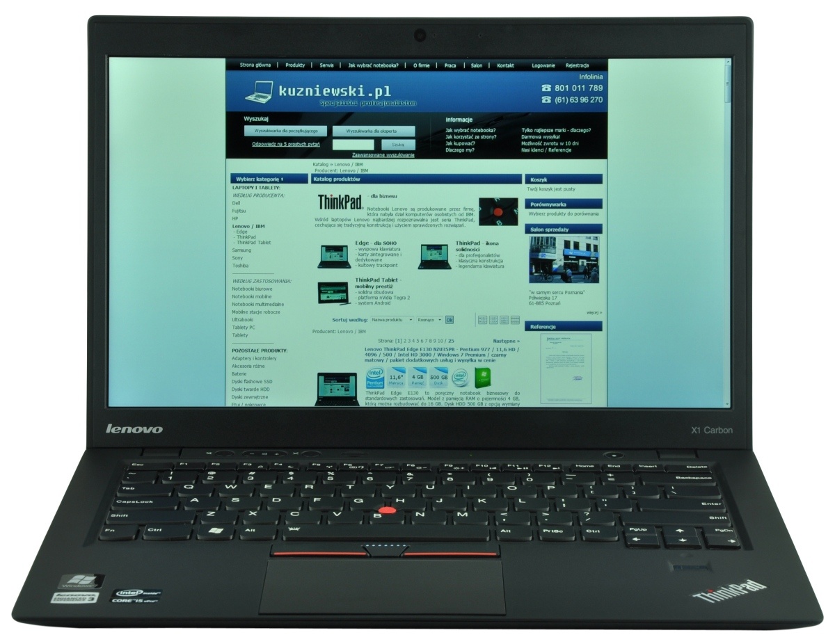 lenovo-thinkpad-x1-carbo_118382 - lab-kuzniewski.pl - Testy laptopów, recenzje i porównania Lenovo ThinkPad X1 Carbon laptop open, showing a blue-toned website on its screen with navigation bars and product grid