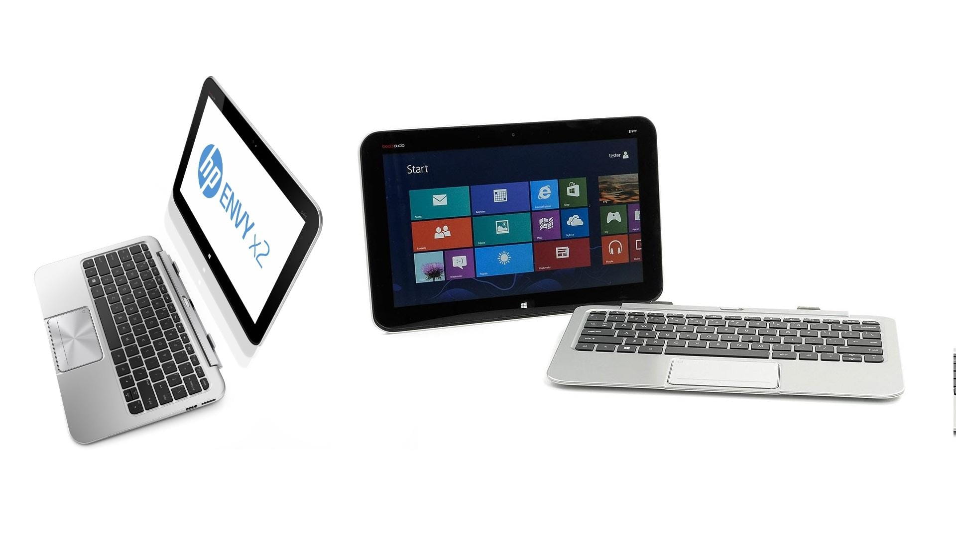 Three silver laptops/tablets arranged diagonally in white space, one displaying the Windows Start screen.