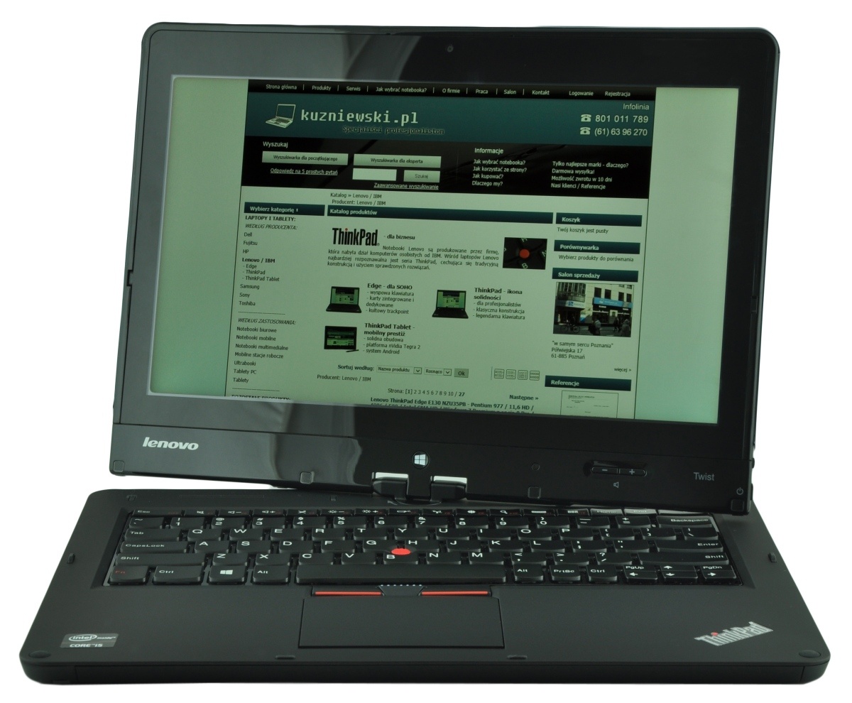 Lenovo ThinkPad laptop open, displaying a green-toned website on the screen.