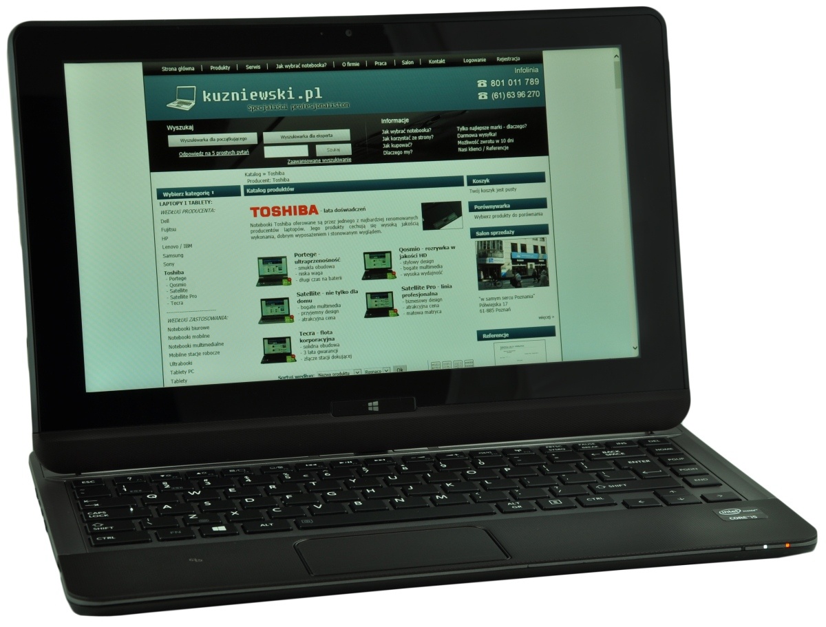 Black laptop open to a Polish electronics site displaying a Toshiba product listing on the screen.