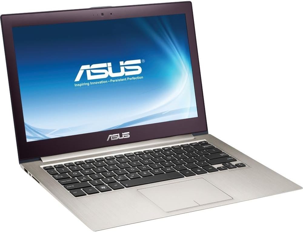 Open silver Asus laptop showing keyboard and touchpad with blue Asus logo screen surface.