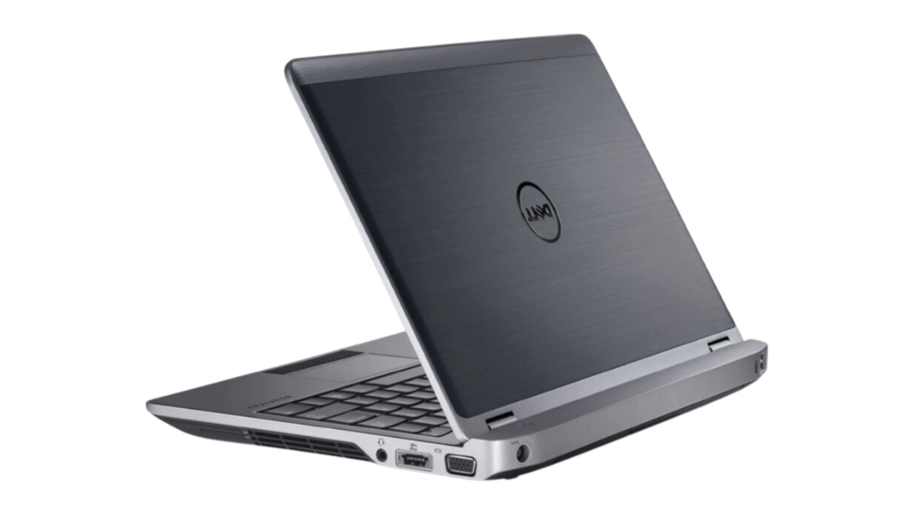 Dell Latitude E6230_0906_05 - lab-kuzniewski.pl - Testy laptopów, recenzje i porównania Open silver Dell laptop shown from the rear-left, with ports visible along the side (HDMI, VGA, Ethernet).