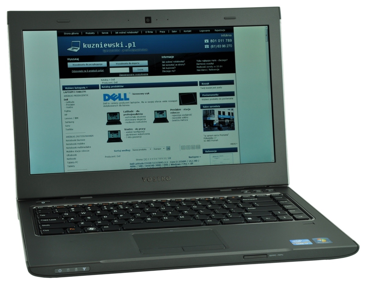 Dell Vostro laptop open to a Polish tech site kuzniewski.pl on the screen