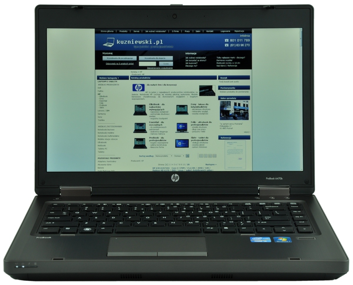 HP ProBook laptop open, displaying a blue website homepage on the screen