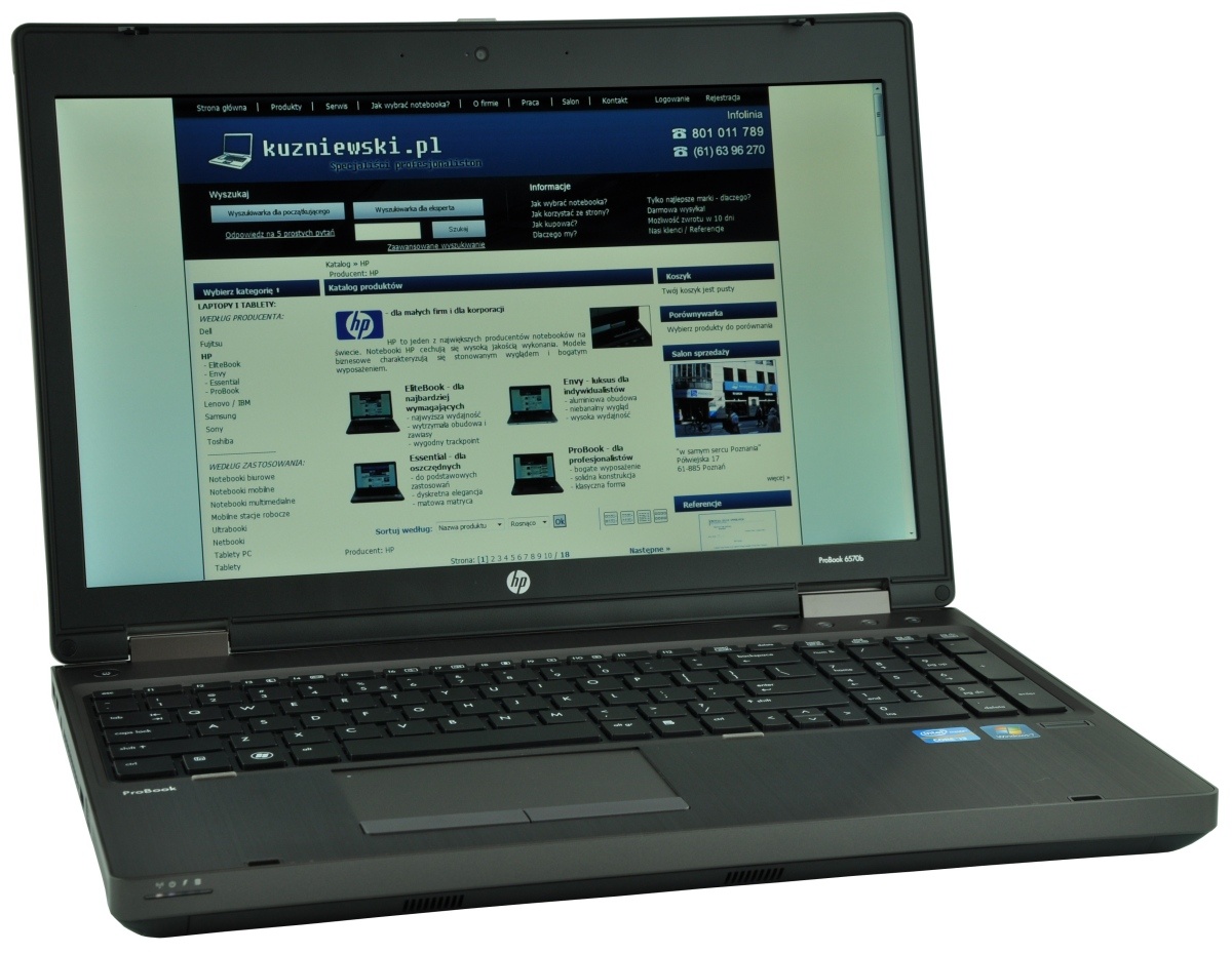 HP ProBook laptop open and displaying a Polish website kuzniewski.pl on the screen.