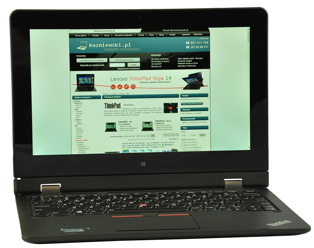 Open black laptop showing a website on the screen, including a Lenovo ThinkPad Yoga 14 banner.