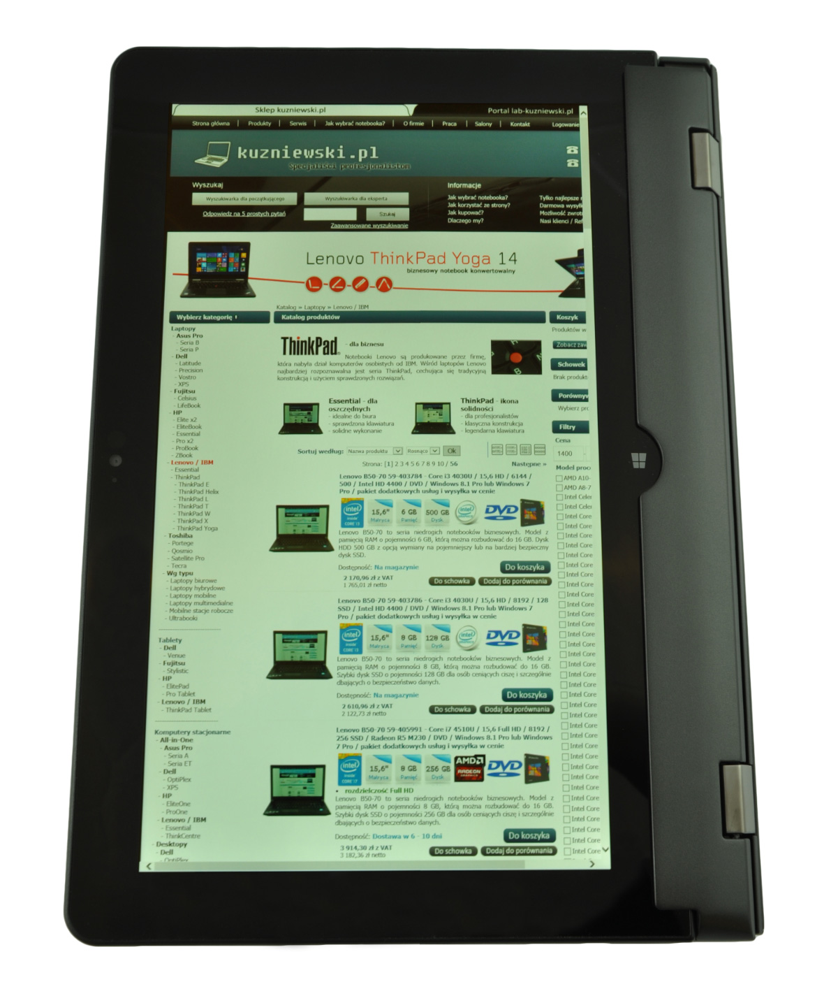 Tablet displaying a Polish electronics retailer's homepage with ThinkPad Yoga banner on the screen outside a white background.