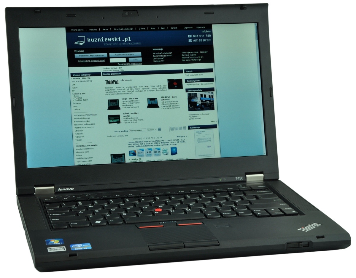 Black Lenovo ThinkPad laptop open, displaying a website on the screen