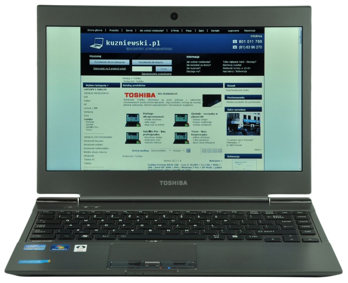 Open silver Toshiba laptop with a website showing a Toshiba product page on the screen