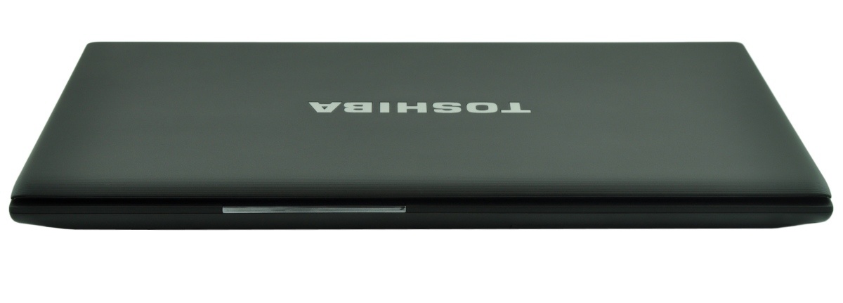 Closed Toshiba laptop viewed from above, showing a slim dark chassis and the logo on the lid.