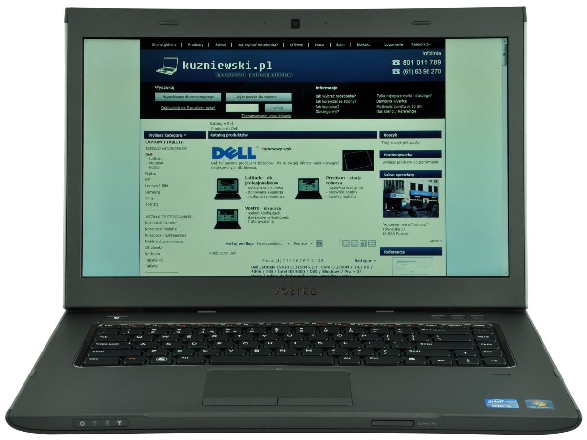 Open Dell Vostro laptop displaying a Polish website on a blue header page, with a full keyboard visible.