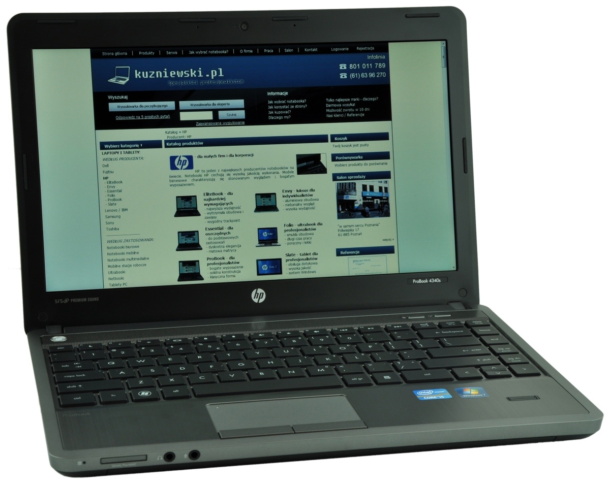 HP ProBook laptop open to a Polish website kuzniewski.pl on the screen.