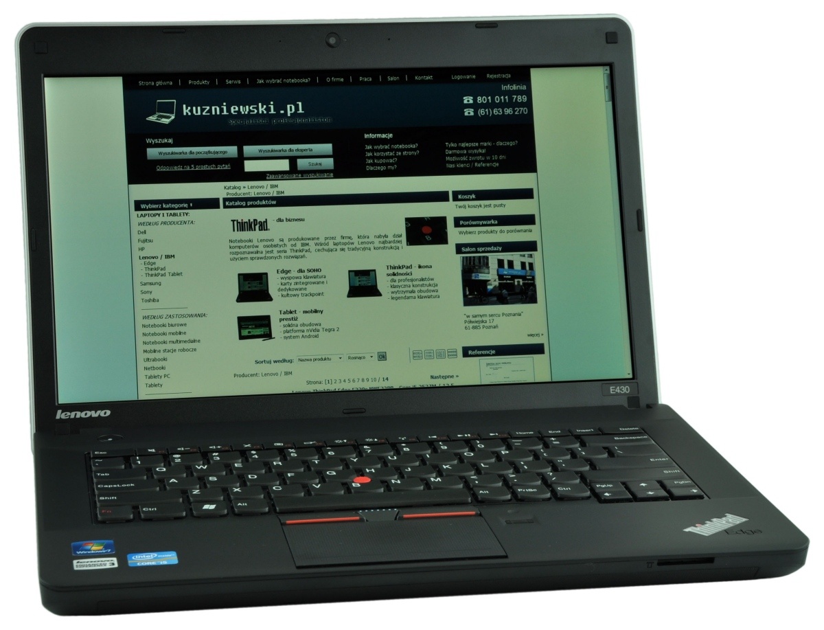 Lenovo ThinkPad laptop open to a Polish-language website displayed on the screen, with a black keyboard and red TrackPoint in the middle.