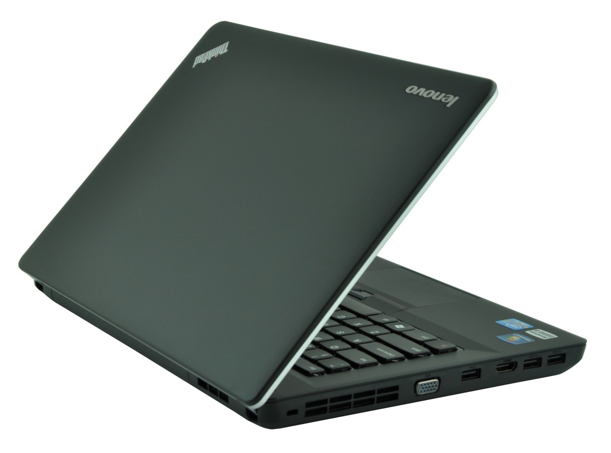 Lenovo laptop partially open, showing keyboard and side USB and VGA ports.