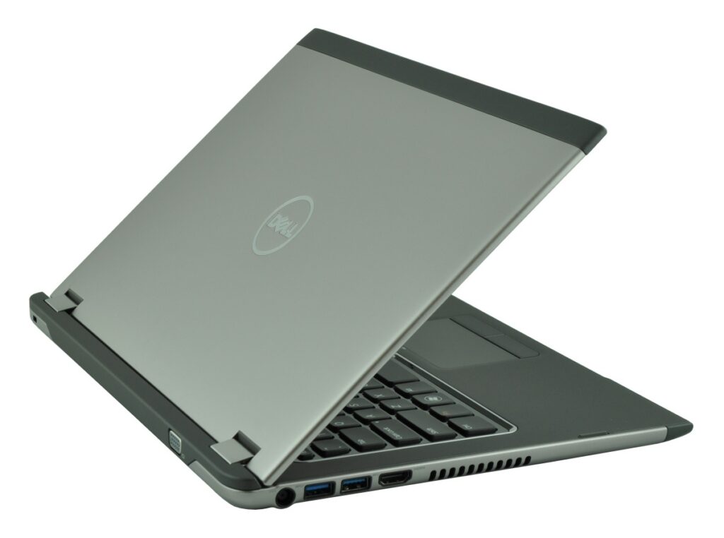 Open Dell laptop with silver lid and dark gray hinge, angled to show side ports and keyboard edge.