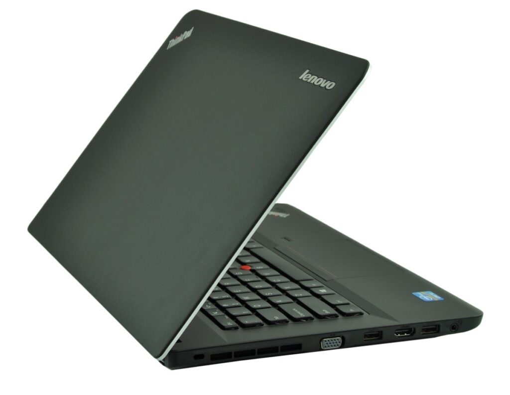 lenovo-thinkpad-edge-e43_122483 - lab-kuzniewski.pl - Testy laptopów, recenzje i porównania Black Lenovo ThinkPad laptop partially open, showing keyboard and side ports (HDMI, USB, VGA) on a white background at an angle.