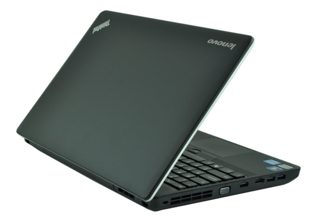Open black Lenovo ThinkPad laptop, angled to show keyboard with ports along the right edge (USB, VGA).
