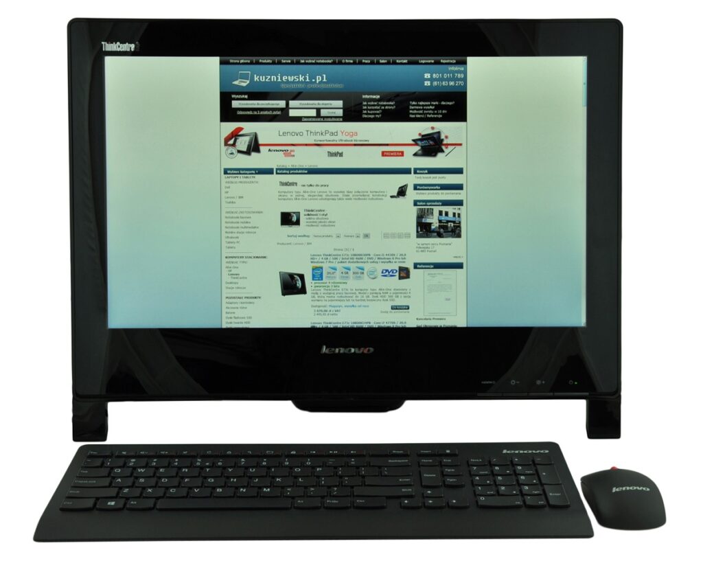 Lenovo all-in-one computer with keyboard and mouse displaying a website on the screen