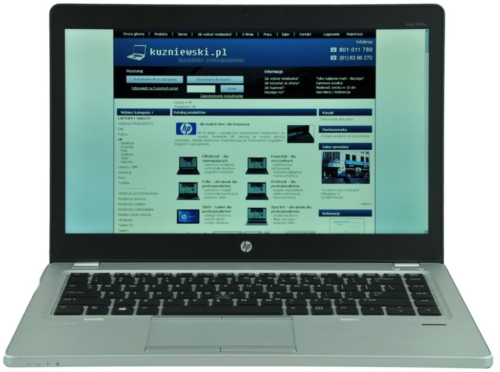 HP laptop open to a Polish website with a blue header displayed on the screen.