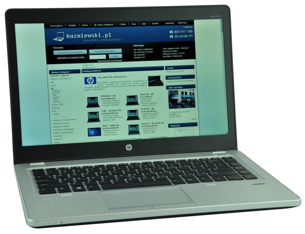 HP laptop open, screen displaying a blue, e-commerce style website homepage