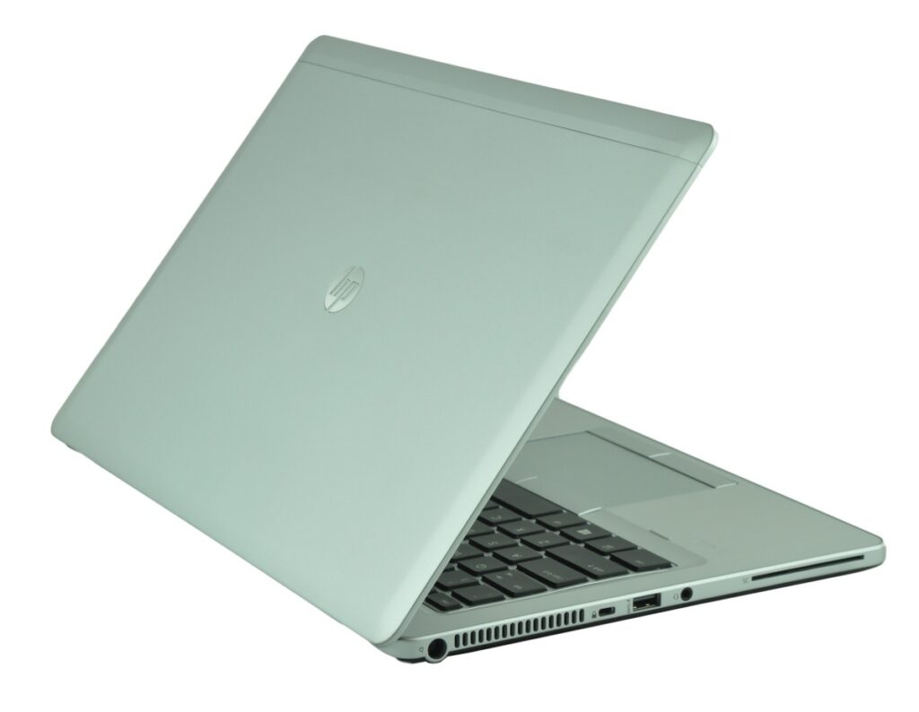 Open silver laptop viewed from a low front-left angle, keyboard showing with side ports visible.