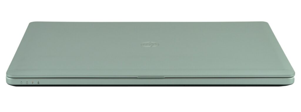 Closed silver/green laptop with HP logo, viewed from a low front angle on a white background.