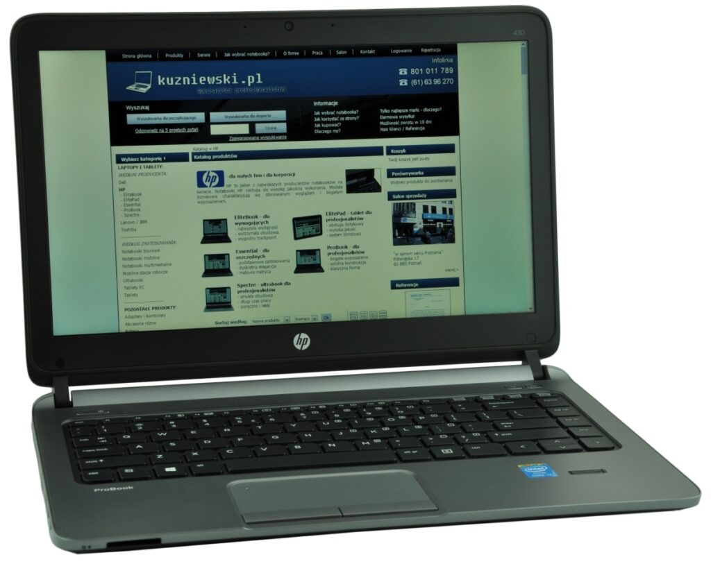 hp-probook-430-h0v12ea-c_126245 - lab-kuzniewski.pl - Testy laptopów, recenzje i porównania Open HP ProBook laptop displaying a Polish website on its screen, angled view.