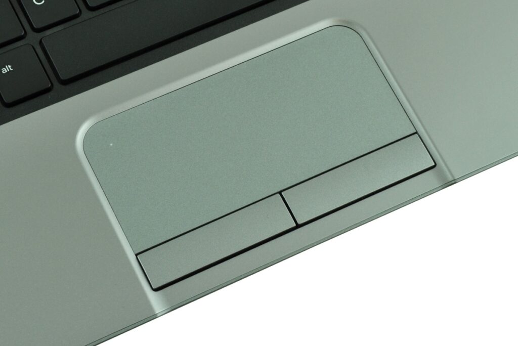 hp-probook-430-h0v12ea-c_126248 - lab-kuzniewski.pl - Testy laptopów, recenzje i porównania Close-up of a laptop touchpad with two physical buttons and part of the keyboard edge above it.