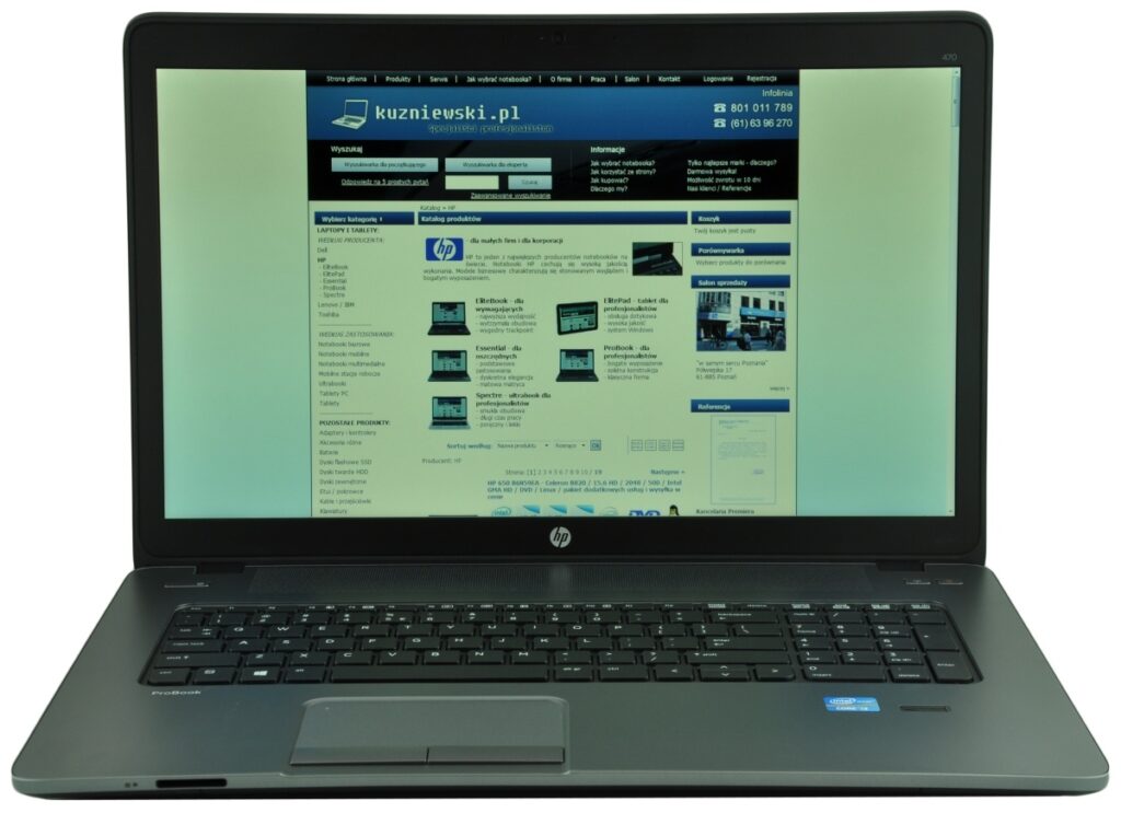 Open HP ProBook laptop displaying a blue-toned website on its screen, with visible keyboard and touchpad.