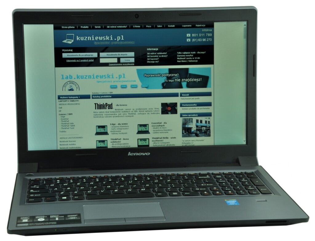 Lenovo ThinkPad laptop displaying a Polish tech website with navigation bars and product listings on the screen