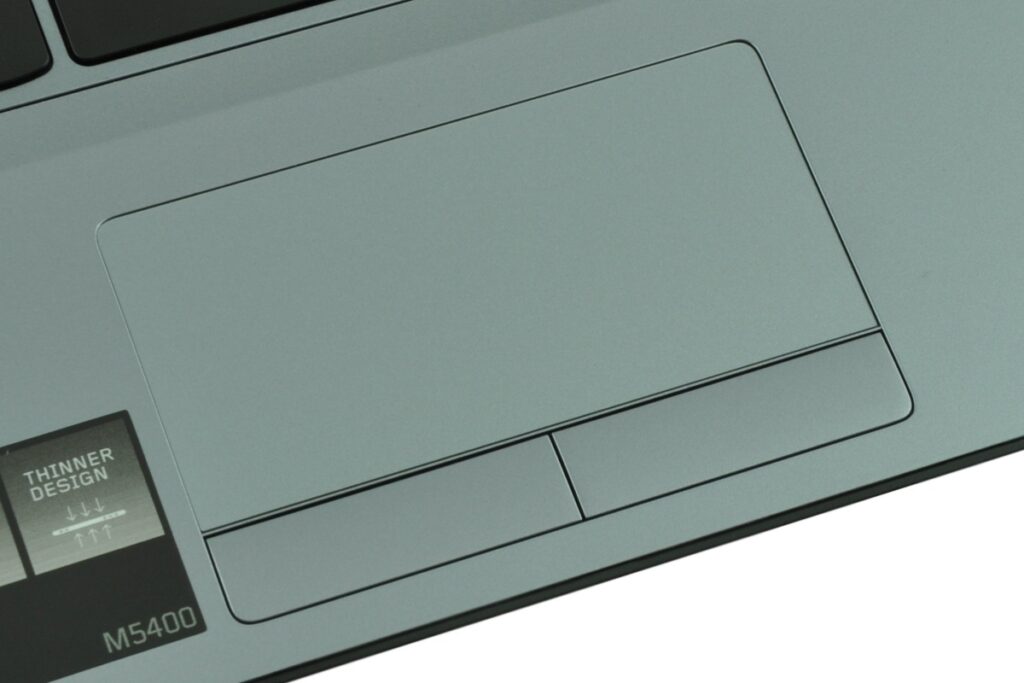Close-up of a laptop touchpad and palm rest, with a 'THINNER DESIGN' label and model M5400 in the bottom left corner.