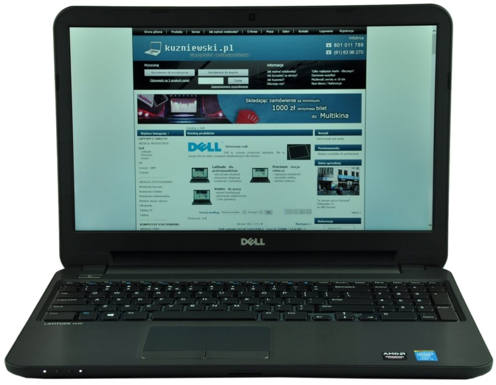 Open Dell Latitude laptop displaying a Polish e-commerce site kuzniewski.pl on the screen.