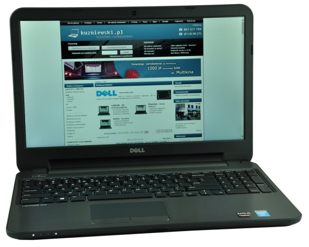 Dell Latitude laptop open, displaying a blue website on its screen.