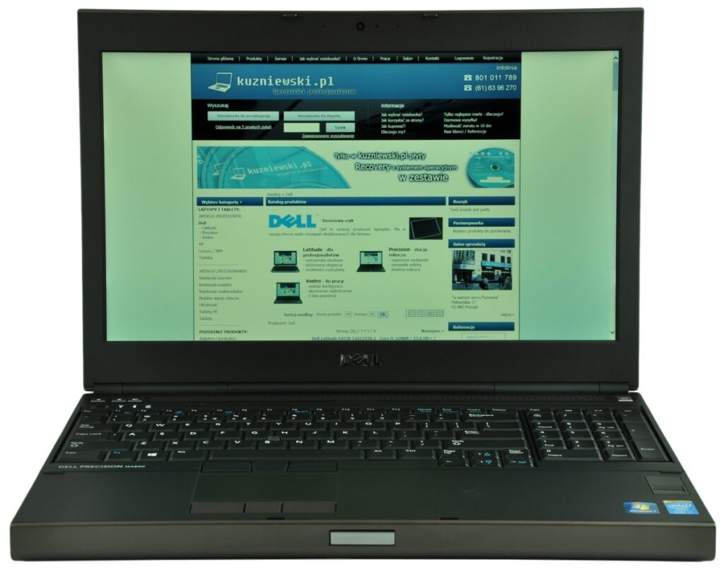 dell-precision-m4800-516_125161 - lab-kuzniewski.pl - Testy laptopów, recenzje i porównania Open Dell laptop displaying a Polish business website on the screen, with blue navigation bars and product images