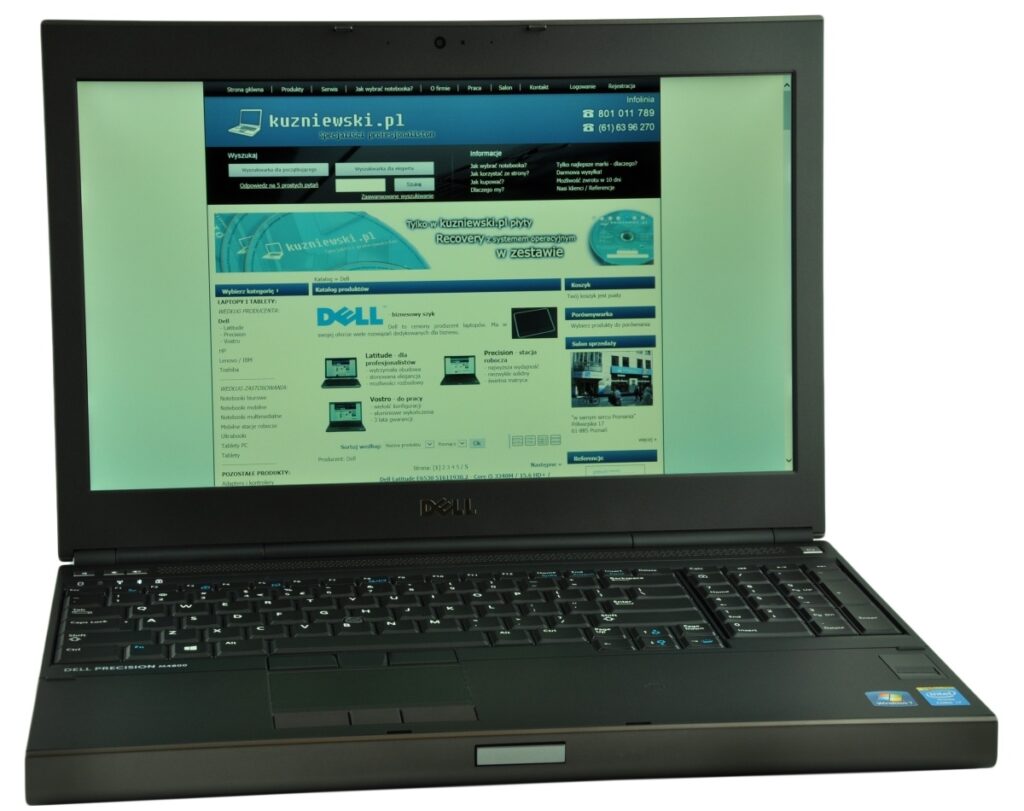 dell-precision-m4800-516_125163 - lab-kuzniewski.pl - Testy laptopów, recenzje i porównania Dell laptop open with a blue-teal website on screen (kuzniewski.pl) displayed on a dark, black laptop.