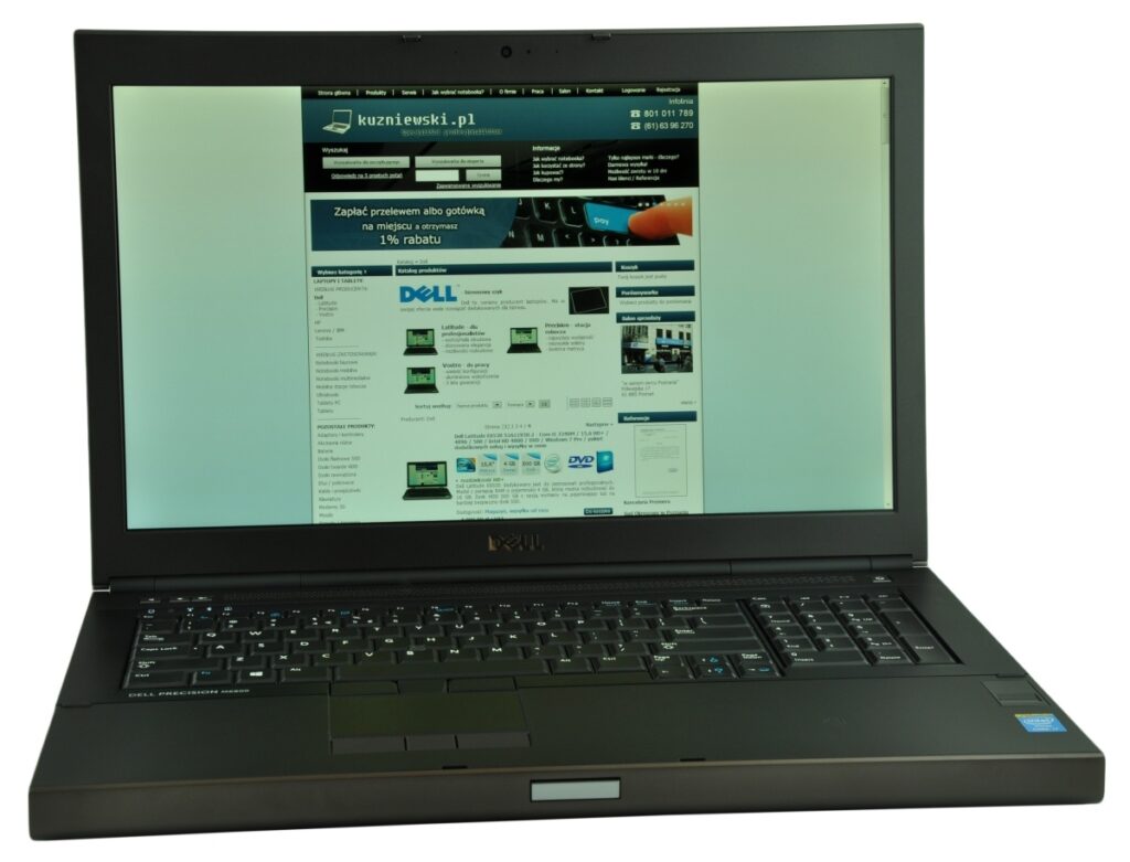dell-precision-m6800-516_125148 - lab-kuzniewski.pl - Testy laptopów, recenzje i porównania Dell laptop open, displaying a website on a teal gradient background.