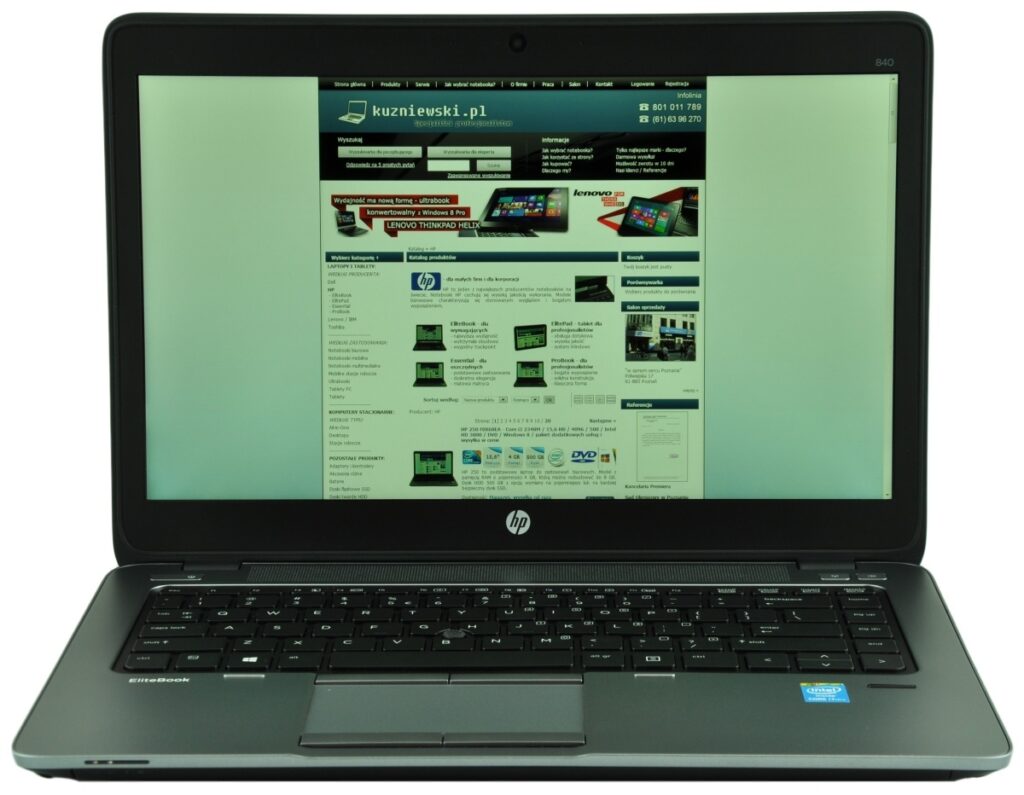 Open HP laptop displaying a website on the screen, with a black keyboard and silver body.