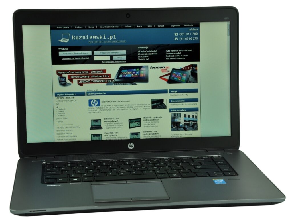 Open HP laptop displaying a website on the screen, showing a tech storefront with blue header and product sections