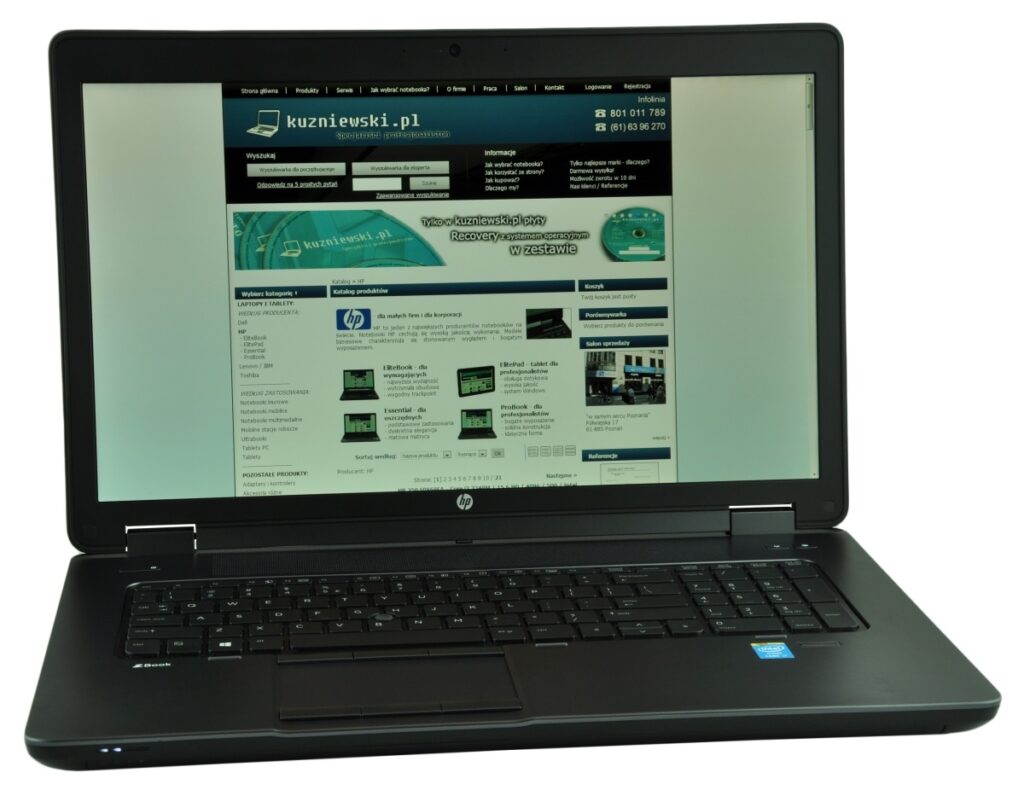 hp-zbook-17-g1-f0v51ea-c_126981 - lab-kuzniewski.pl - Testy laptopów, recenzje i porównania Black HP laptop open to the kuzniewski.pl homepage displayed on the screen, showing a Polish tech site.