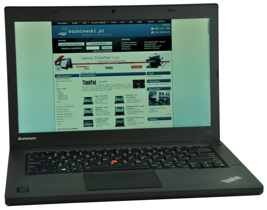 Lenovo ThinkPad laptop open, displaying a website on the screen with a blue header and navigation bar.