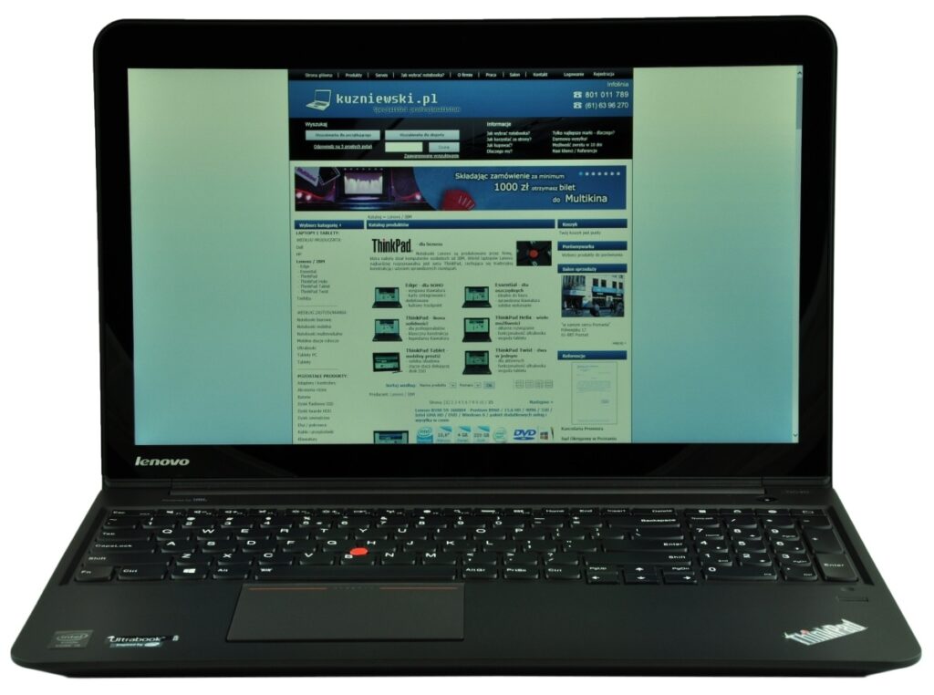 Lenovo ThinkPad laptop open with a Polish website displayed on the screen.