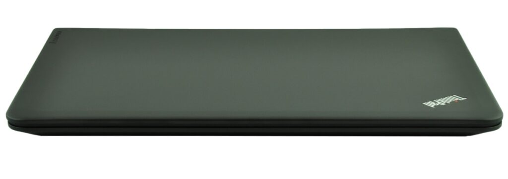Closed dark gray Lenovo ThinkPad laptop seen from the side, lid shut and resting flat on a surface.