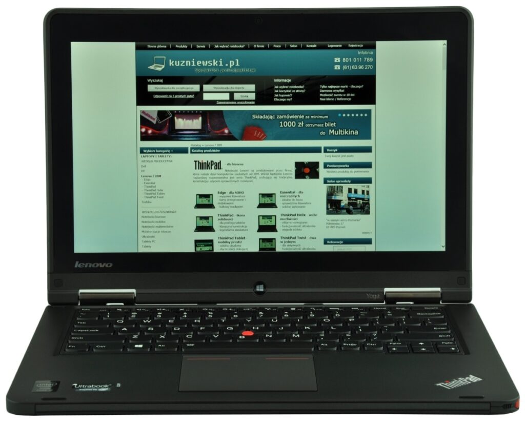 Lenovo ThinkPad laptop open, screen shows a Polish website homepage.